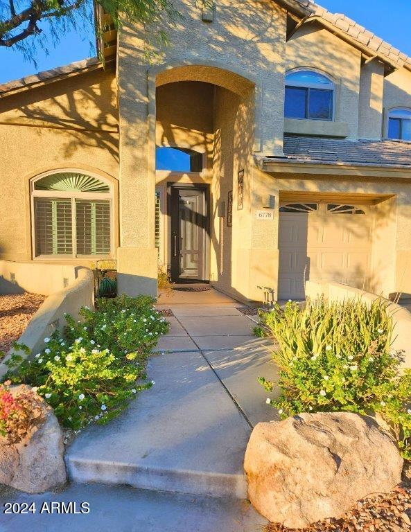 entrance to property featuring a garage