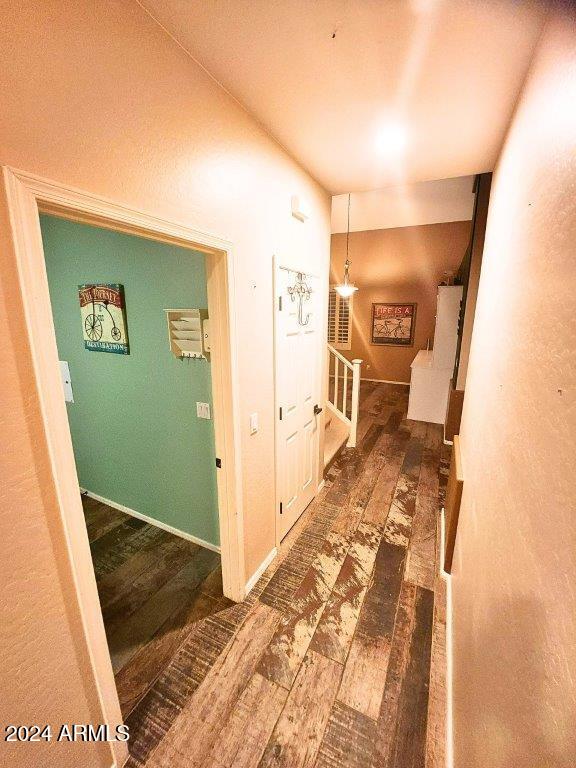 corridor with dark wood-type flooring