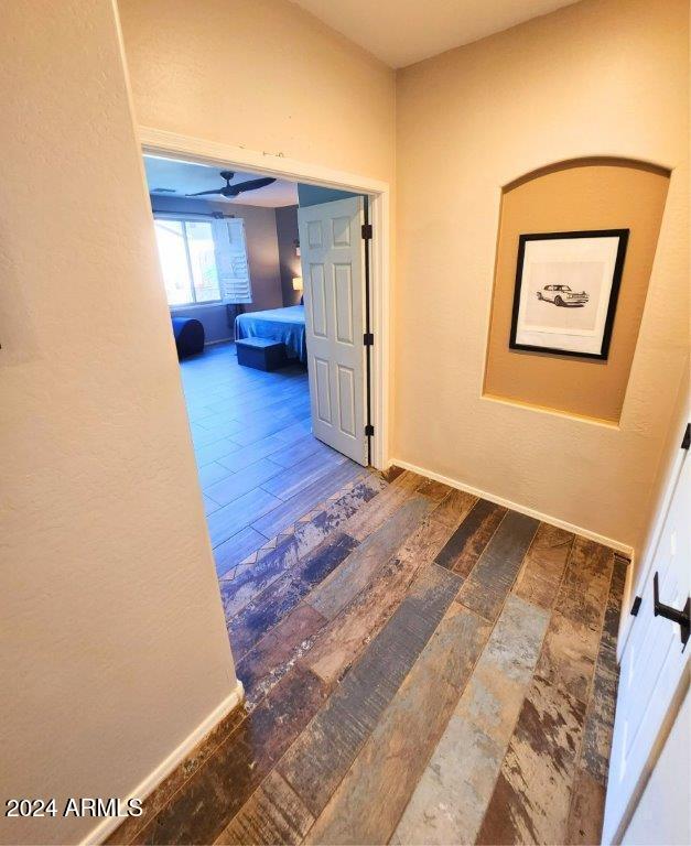 hallway with wood-type flooring