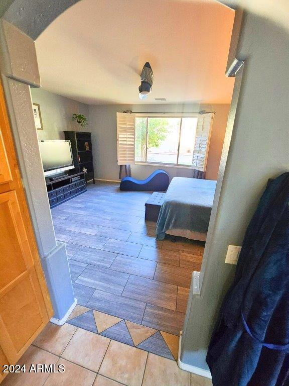 bedroom featuring light tile patterned flooring