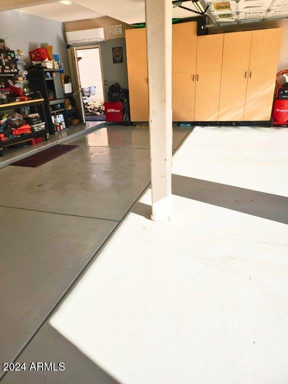 garage with a wall mounted air conditioner