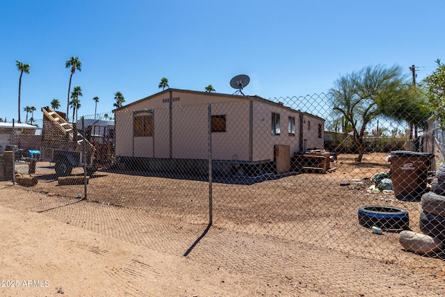 view of home's exterior with fence