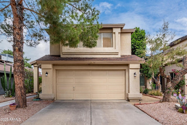 view of front of house featuring stucco siding, driveway, roof with shingles, and an attached garage