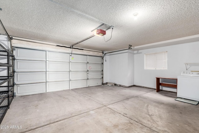 garage featuring washer / dryer and a garage door opener