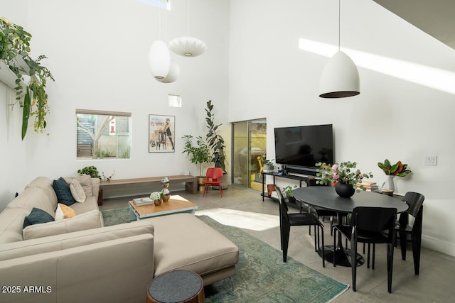 living room with a high ceiling