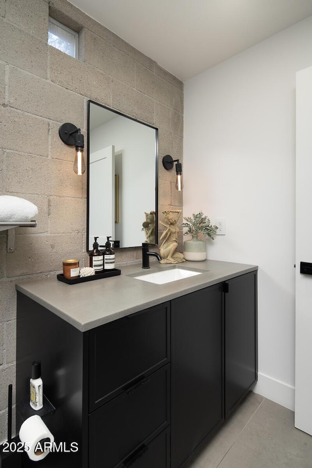 bathroom featuring tile patterned flooring and vanity