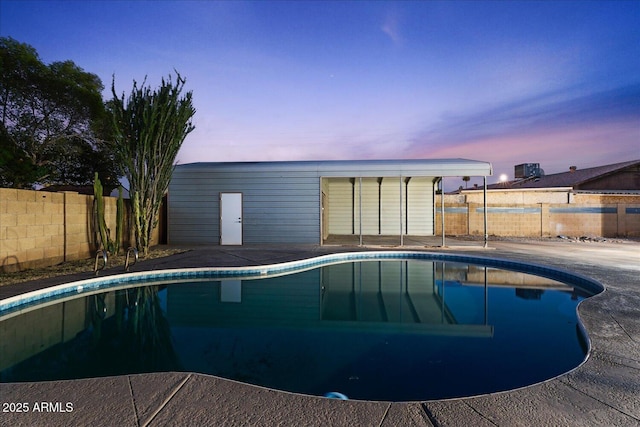 3506 W Yucca St, Phoenix, AZ 85029 - pool at dusk with a fenced backyard