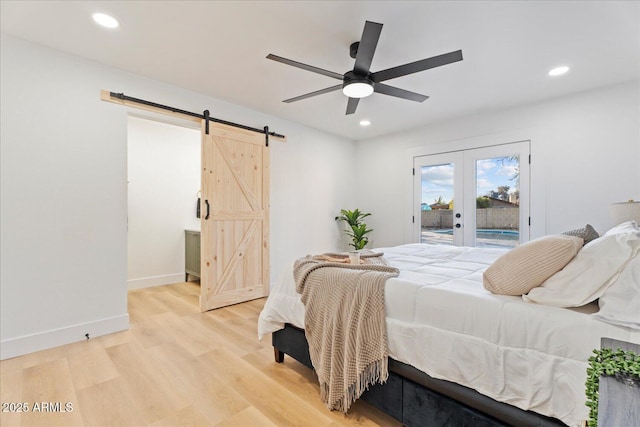 3506 W Yucca St, Phoenix, AZ 85029 - bedroom featuring a barn door, access to exterior, french doors, recessed lighting, and light wood finished floors