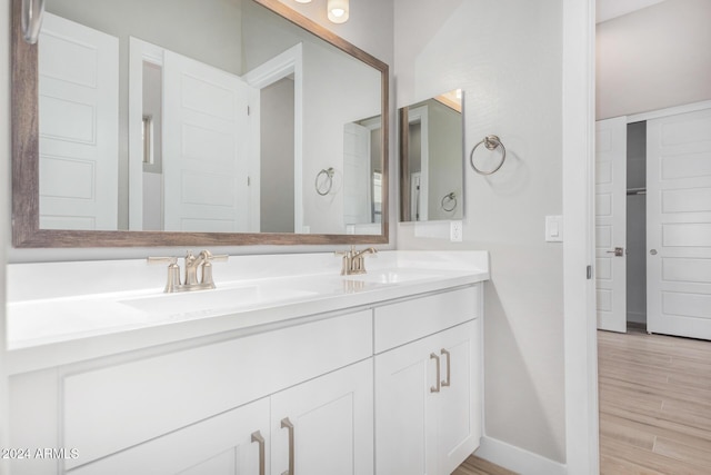 bathroom with vanity and hardwood / wood-style floors