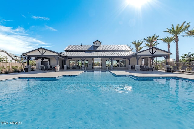 view of pool featuring a gazebo and a patio