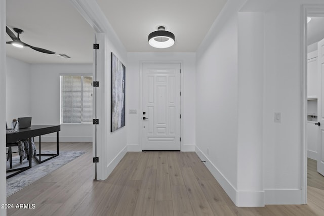 interior space featuring light wood-type flooring and ceiling fan