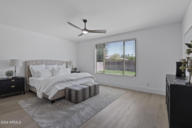 bedroom with ceiling fan and light wood-type flooring