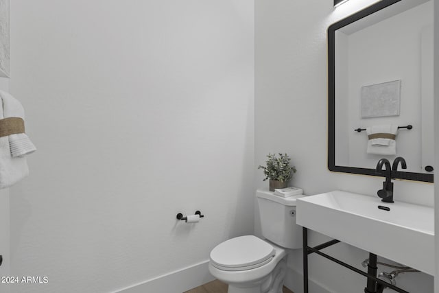 bathroom with sink and toilet