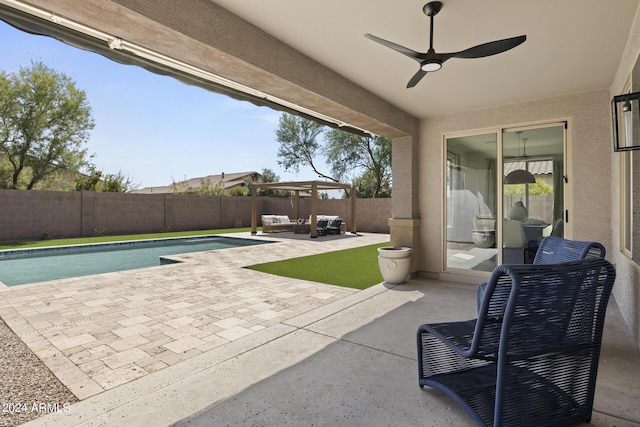 view of patio / terrace featuring a fenced in pool, an outdoor living space, and ceiling fan