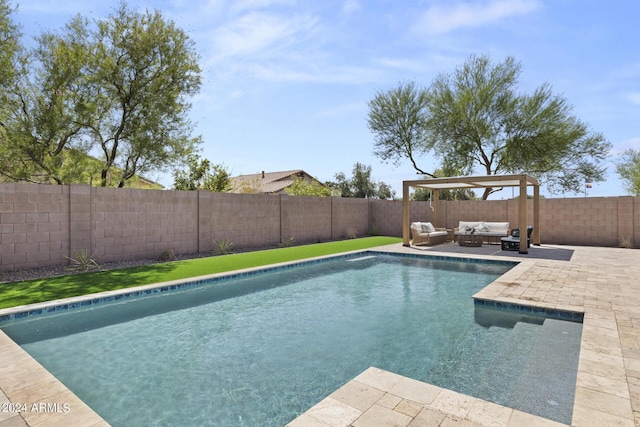 view of pool with outdoor lounge area and a patio area