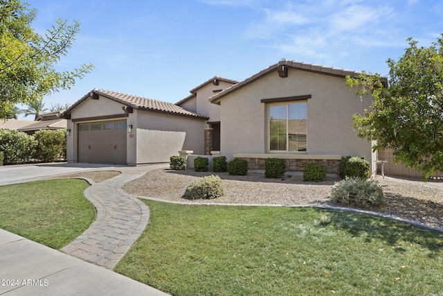 view of front of property featuring a garage and a front yard