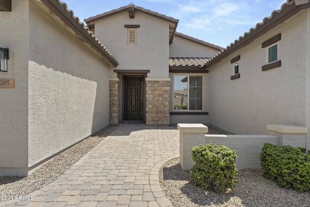 doorway to property featuring a patio area