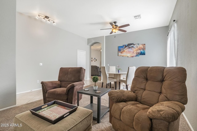 living room with ceiling fan and light tile patterned floors