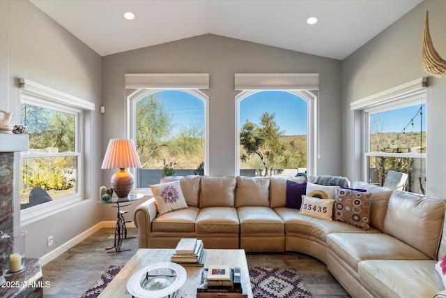 sunroom / solarium with vaulted ceiling and a healthy amount of sunlight