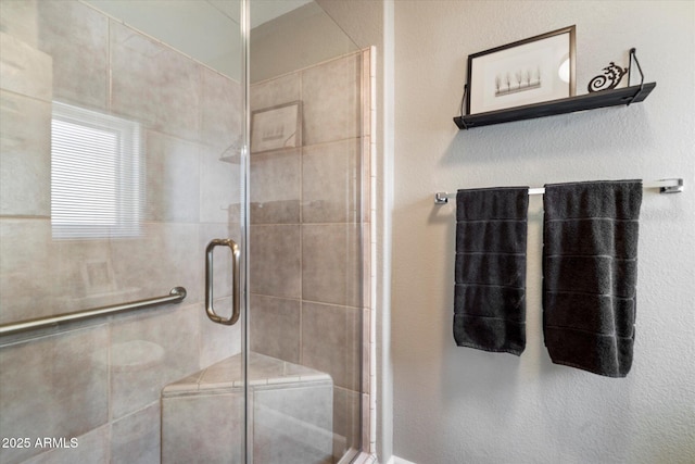 bathroom with a shower stall