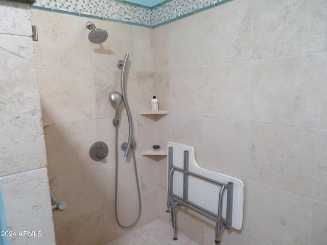 full bathroom with a tile shower