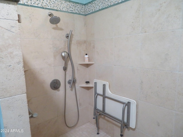 bathroom with tiled shower