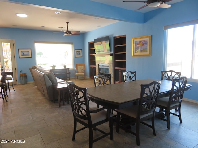 dining space with ceiling fan