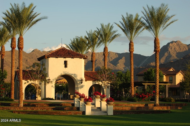 exterior space featuring a yard and a mountain view