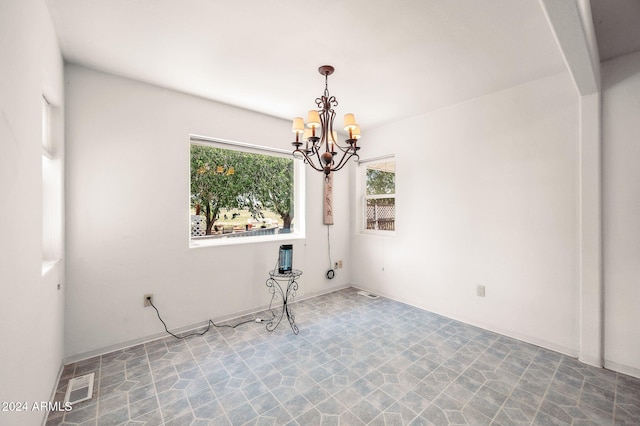 1120 N Rd 1 E, Chino Valley, AZ 86323 - unfurnished room with a chandelier