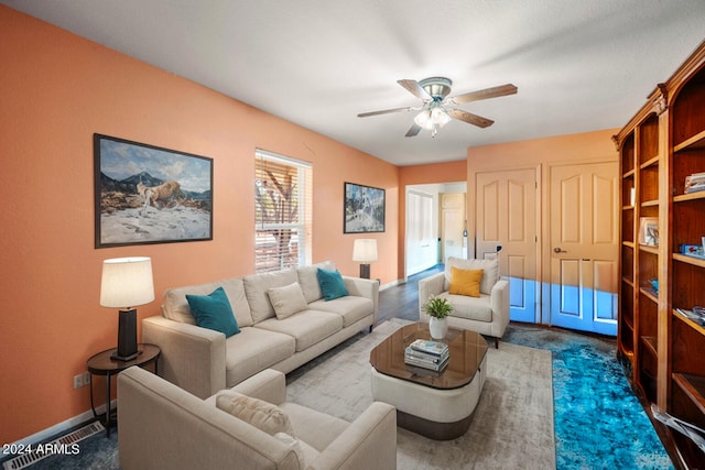 1120 N Rd 1 E, Chino Valley, AZ 86323 - living area featuring ceiling fan, baseboards, and dark carpet