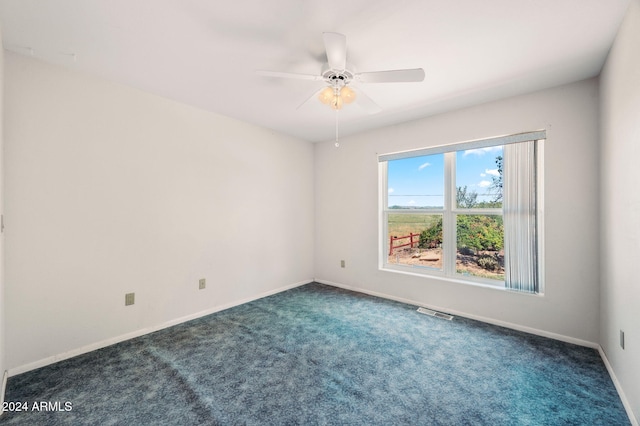 1120 N Rd 1 E, Chino Valley, AZ 86323 - empty room featuring carpet floors, a ceiling fan, and baseboards