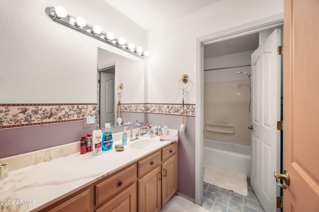 bathroom with tub / shower combination and vanity