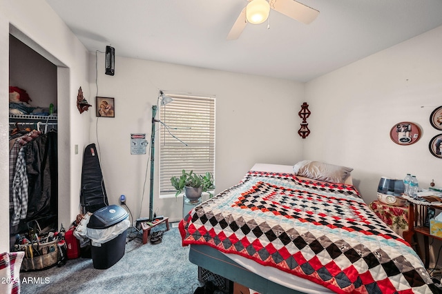 carpeted bedroom with a closet and ceiling fan