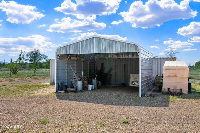 1120 N Rd 1 E, Chino Valley, AZ 86323 - view of pole building with a detached carport and gravel driveway