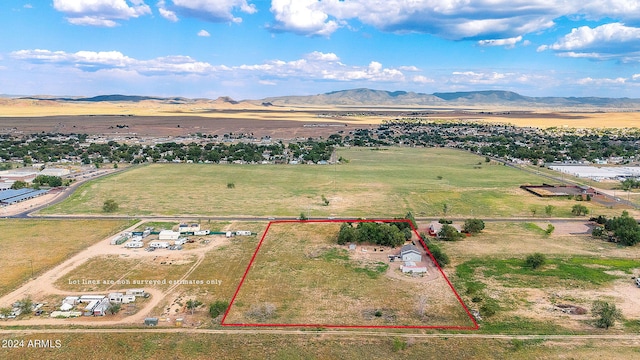 1120 N Rd 1 E, Chino Valley, AZ 86323 - aerial view of sparsely populated area featuring a mountainous background and property boundaries highlighted