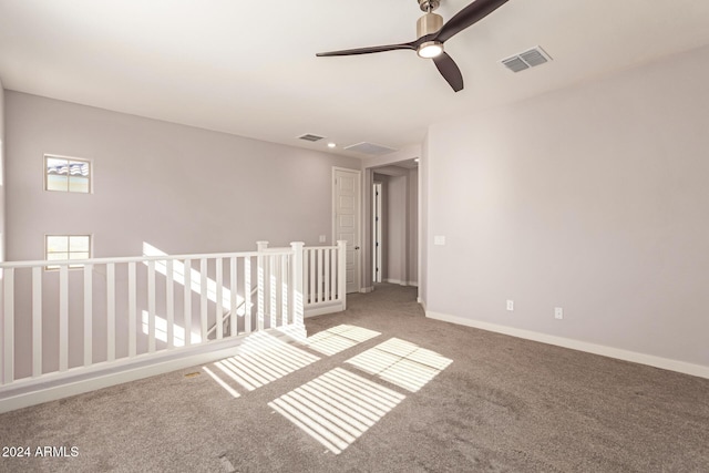 unfurnished room featuring carpet flooring and ceiling fan