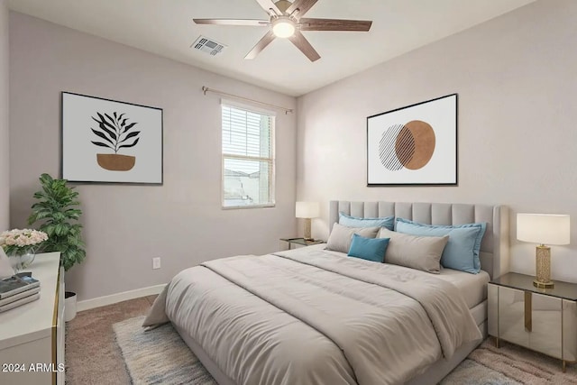 bedroom with ceiling fan and light carpet