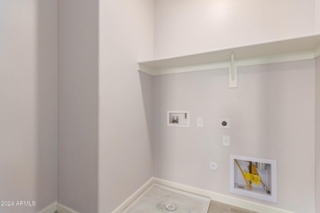 laundry room with hookup for an electric dryer, hookup for a washing machine, hookup for a gas dryer, and hardwood / wood-style floors