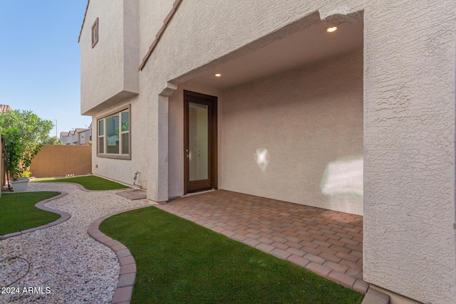 doorway to property with a patio