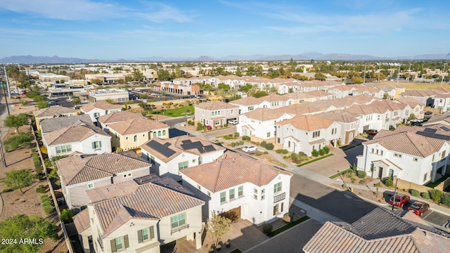 birds eye view of property featuring a mountain view