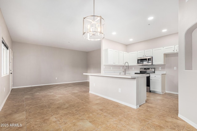 kitchen with sink, hanging light fixtures, stainless steel appliances, a chandelier, and white cabinets