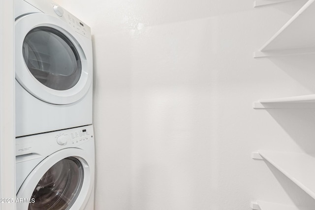 laundry room with stacked washer and dryer