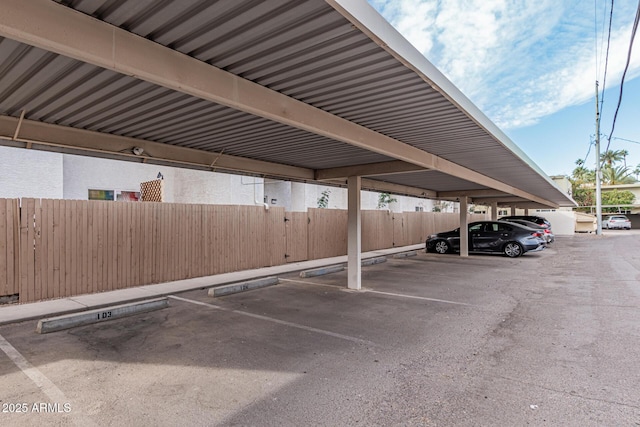 view of parking / parking lot with a carport