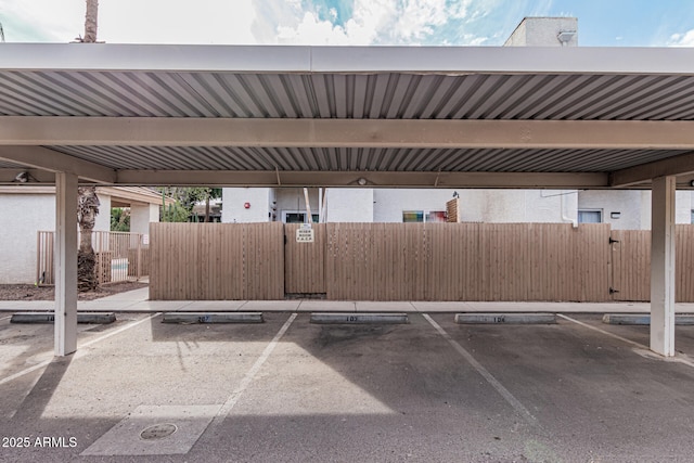 view of parking / parking lot with a carport