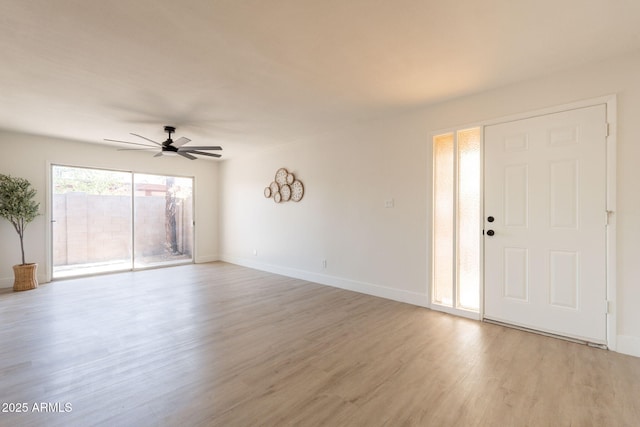 909 S Acapulco Ln Unit A, Tempe, AZ 85281 - unfurnished living room featuring ceiling fan, light wood finished floors, and baseboards
