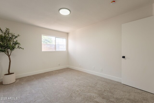 909 S Acapulco Ln Unit A, Tempe, AZ 85281 - carpeted spare room with baseboards and a smoke detector