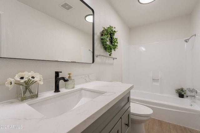 909 S Acapulco Ln Unit A, Tempe, AZ 85281 - full bath with vanity, wood finished floors, toilet, and bathtub / shower combination