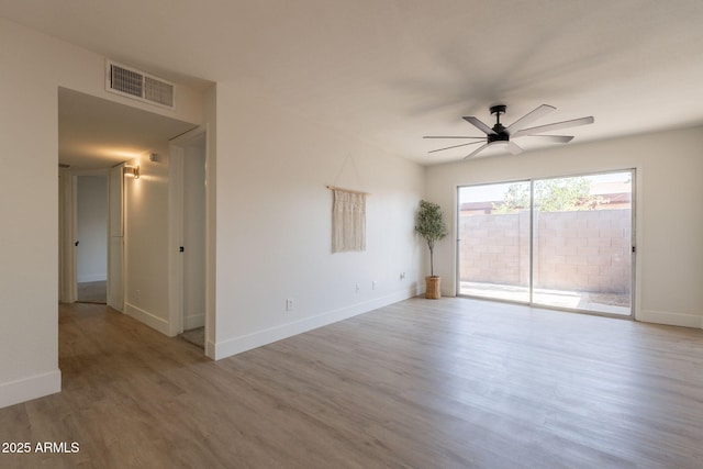 909 S Acapulco Ln Unit A, Tempe, AZ 85281 - unfurnished room with ceiling fan, wood finished floors, and baseboards