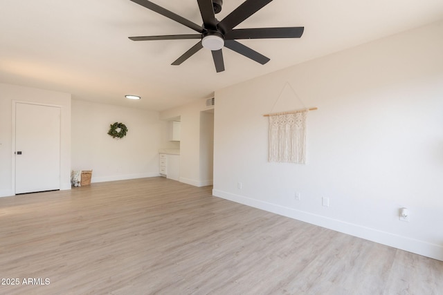 909 S Acapulco Ln Unit A, Tempe, AZ 85281 - unfurnished living room featuring baseboards, light wood finished floors, and ceiling fan