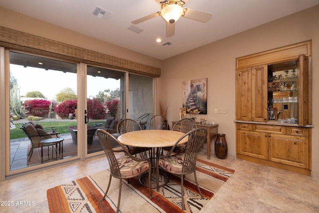 dining room featuring ceiling fan